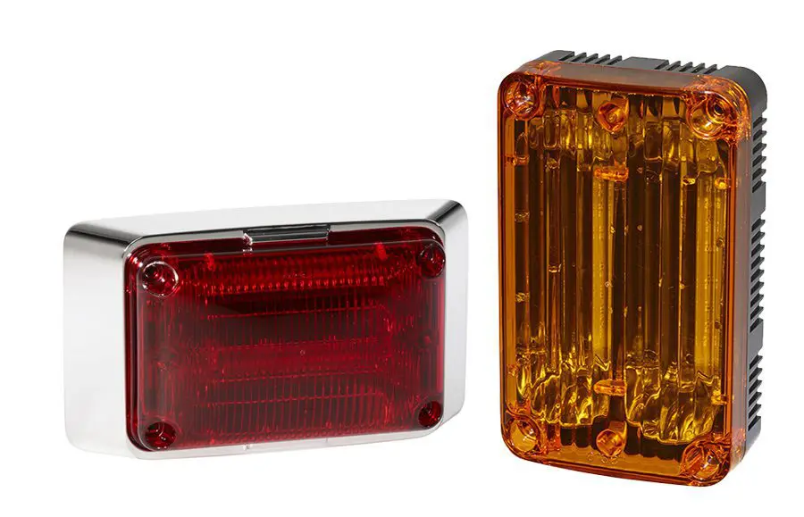 Two rectangular vehicle lights: one with a red lens and chrome trim, and the other with an amber lens and black trim, positioned side by side.