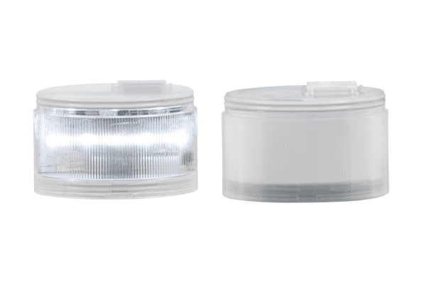 Two transparent cylindrical LED lights, one turned on with visible light, the other off, both with plastic lids.