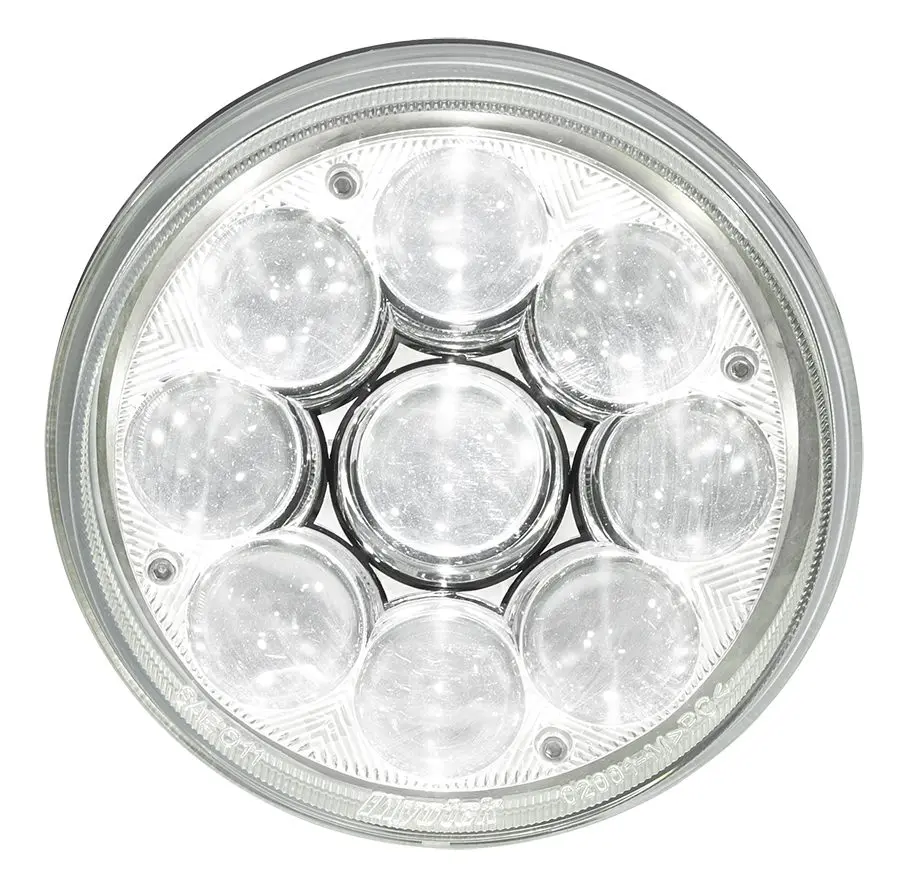 Close-up of a round LED light with seven individual lens segments inside a circular frame.