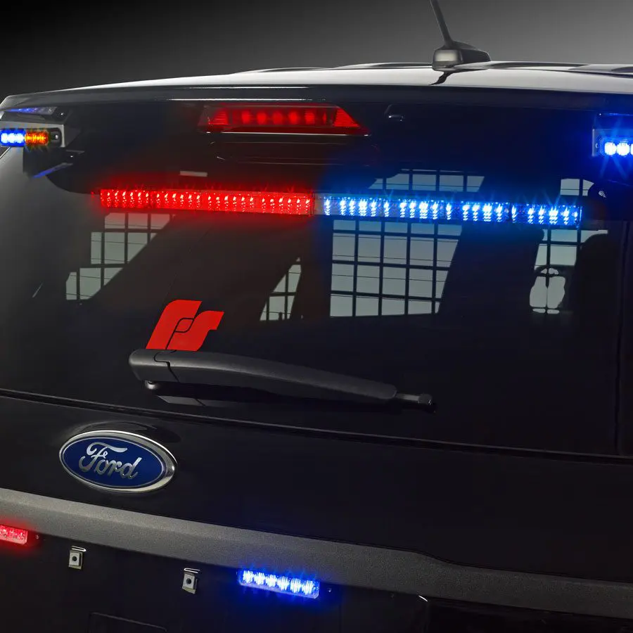 Red and blue CN SignalMaster lights on the back of a Ford Police Interceptor Utility.