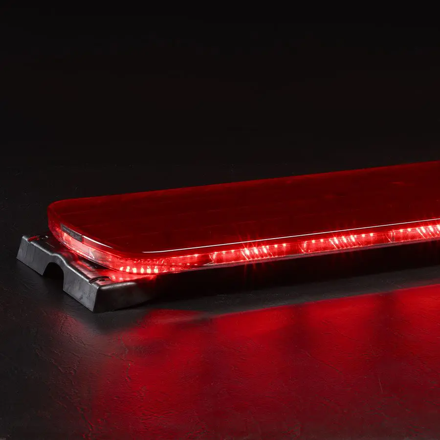 FedSig's Allegiant Serial Light Bar, featuring a red LED with a black base, illuminated against a dark background.