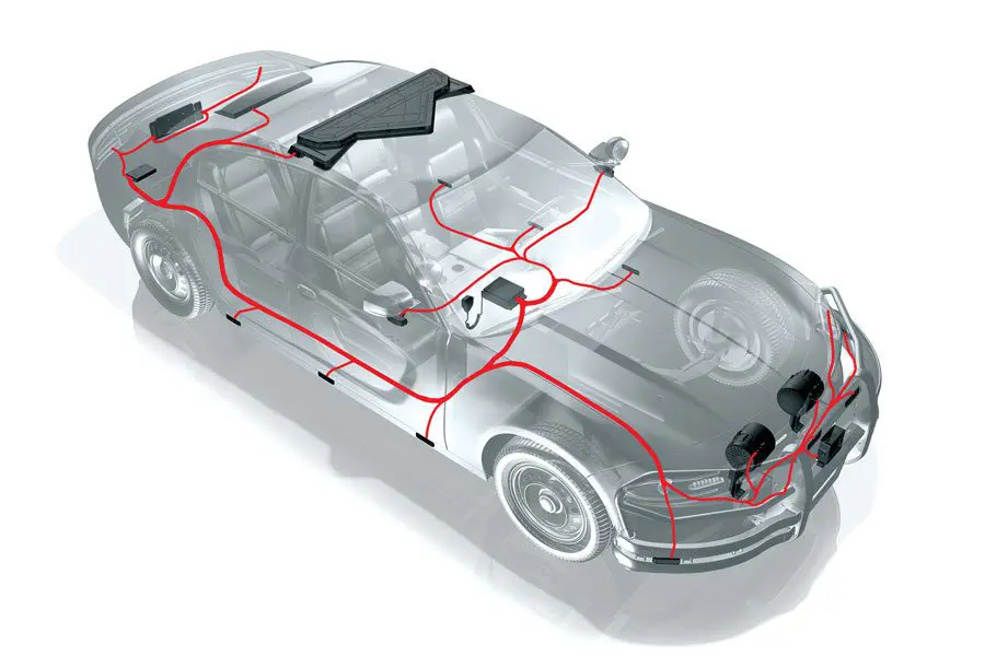 Transparent car model showing an electrical wiring diagram, with highlighted components and circuitry paths throughout the vehicle.