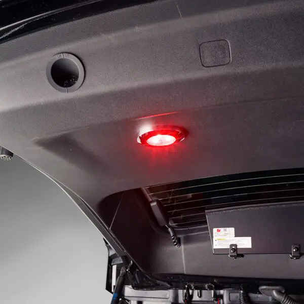 Red light inside the trunk lid of a vehicle.