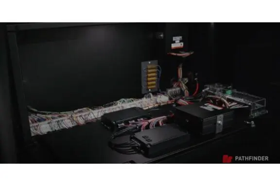 Server rack with neatly organized cables and electronic devices.