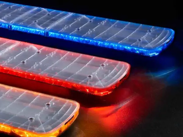Three rectangular LED light bars glow in blue, red, and amber colors, arranged diagonally on a dark surface.