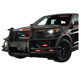 A black police SUV with push bumpers and activated red and blue emergency lights on the grille, roof, and side mirrors.