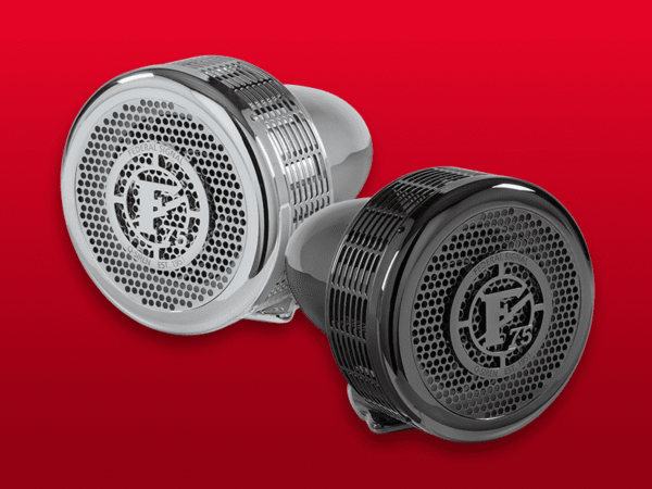 Two metallic showerheads, one silver and one black, featuring a circular perforated design with a logo in the center, displayed on a red background.