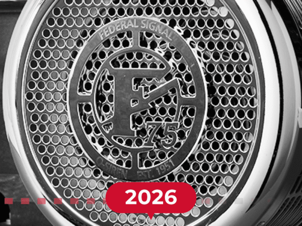 Close-up of a Federal Signal siren grill with a prominent "F" logo and the number 75, with "2026" displayed in bold red text at the bottom.