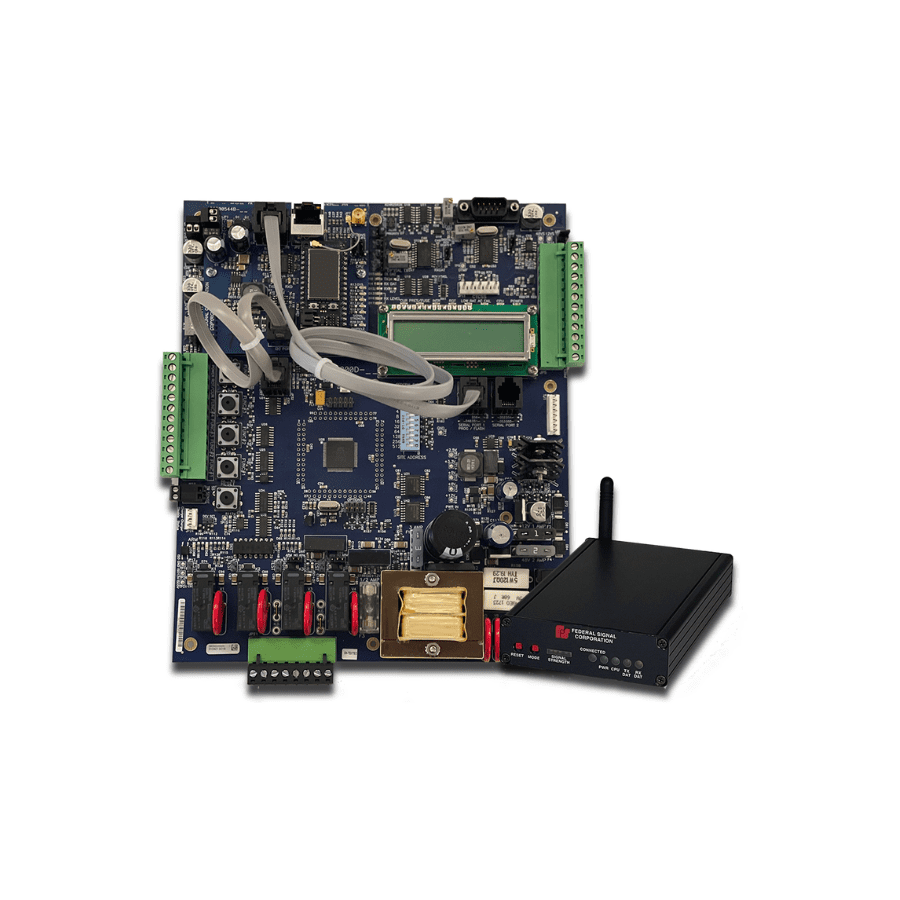 A circuit board with various electronic components, connected wires, and a separate black wireless communication module placed in front.