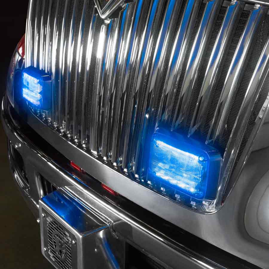 Chrome truck grille with blue QuadraFlare® LED warning lights